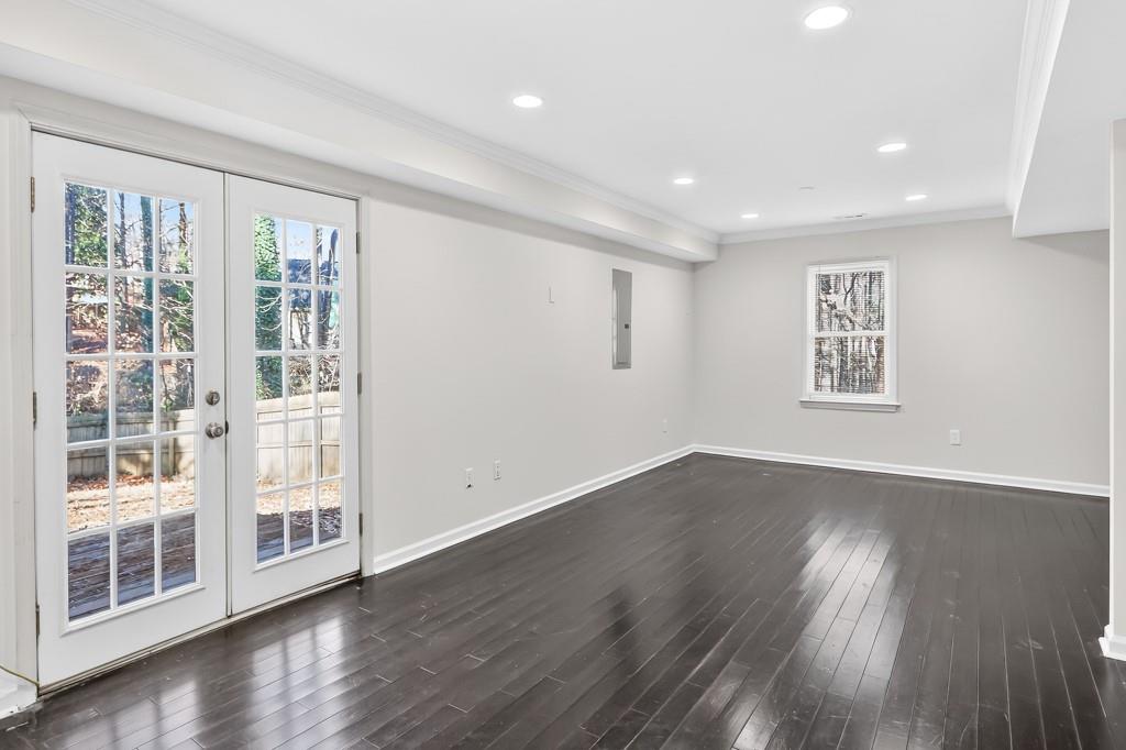4703 North Springs Road Northwest Kennesaw, GA 30144 - Photo 29 of 35 a view of an empty room with wooden floor and a window