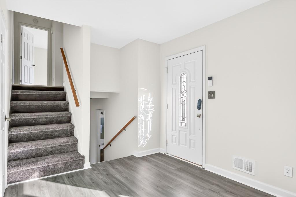 4703 North Springs Road Northwest Kennesaw, GA 30144 - Photo 4 of 35 a view of entryway with wooden floor