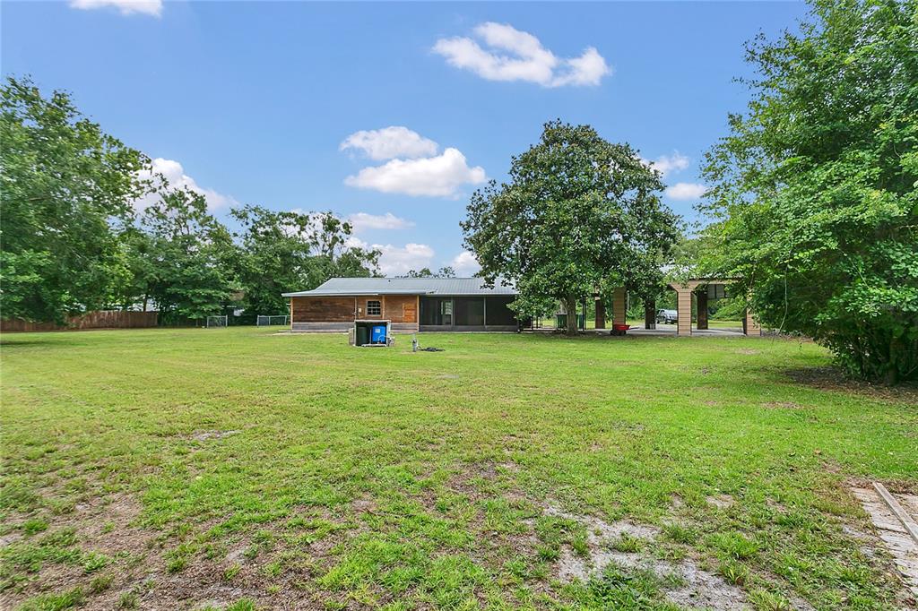 9 Sunny Road Ormond Beach, FL 32174 - Photo 27 of 33 a front view of a house with garden
