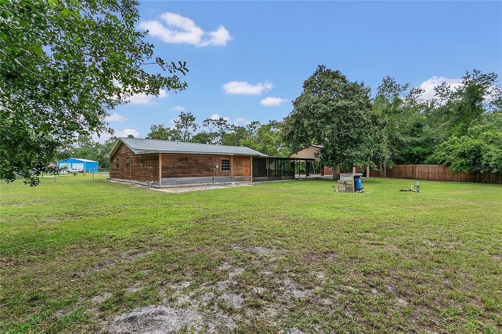 9 Sunny Road Ormond Beach, FL 32174 - Photo 28 of 33 a view of a house with a backyard