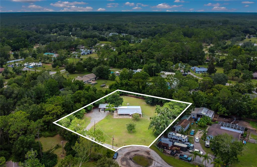 9 Sunny Road Ormond Beach, FL 32174 - Photo 33 of 33 an aerial view of house with yard