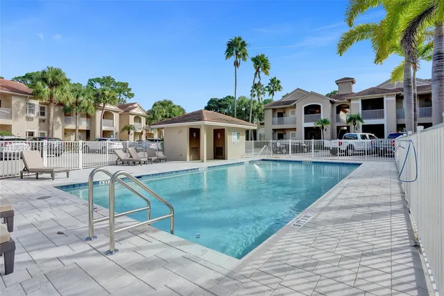 a view of a swimming pool with a patio