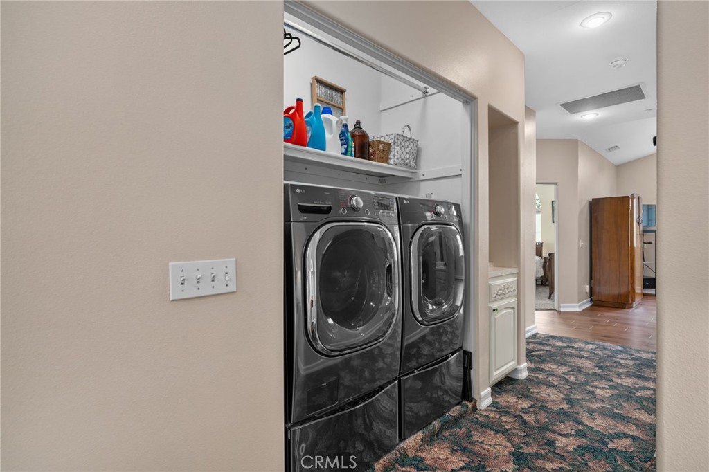 334 Lakeside Avenue Redlands, CA 92373 - Photo 23 of 63 a view of a hallway with washer and dryer