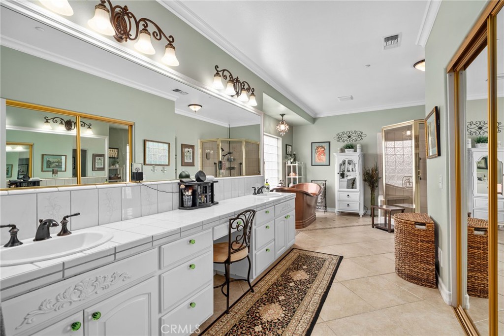 334 Lakeside Avenue Redlands, CA 92373 - Photo 27 of 63 a large bathroom with a large mirror vanity and a shower