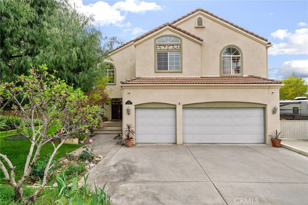 334 Lakeside Avenue Redlands, CA 92373 - Photo 3 of 63 a front view of a house with a yard and garage
