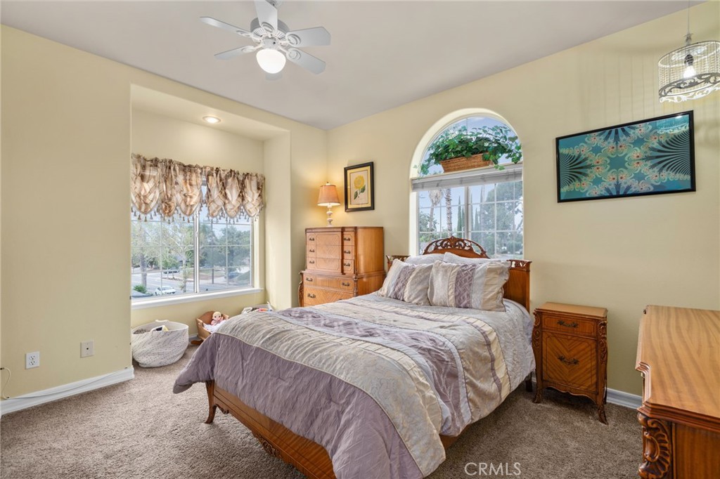 334 Lakeside Avenue Redlands, CA 92373 - Photo 33 of 63 a bedroom with a bed and a painting on the wall