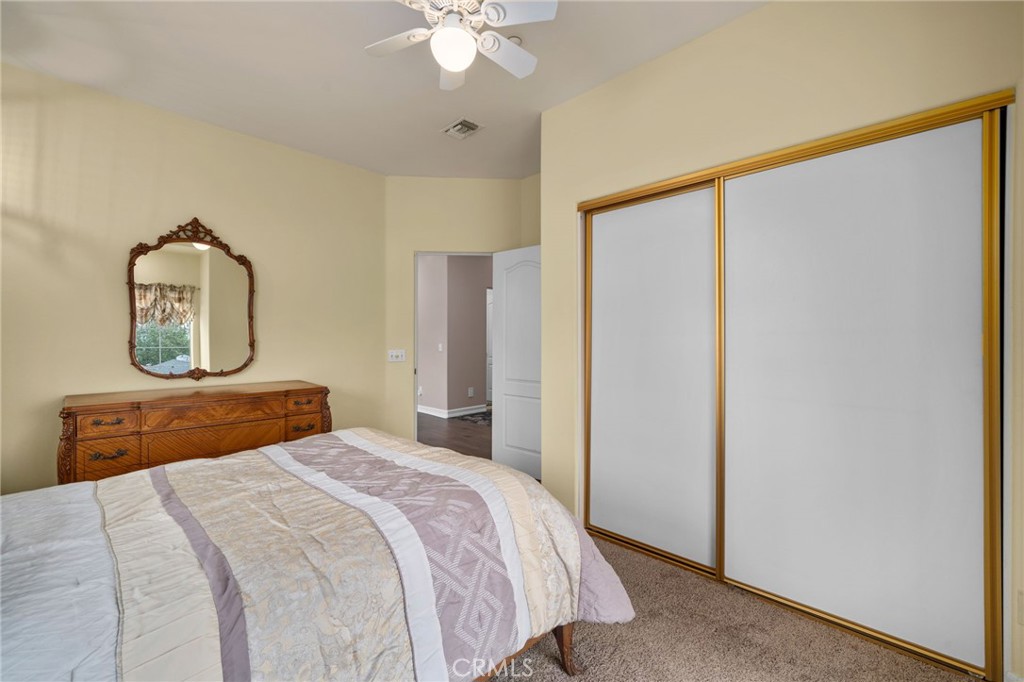 334 Lakeside Avenue Redlands, CA 92373 - Photo 34 of 63 a bedroom with a bed and a chandelier