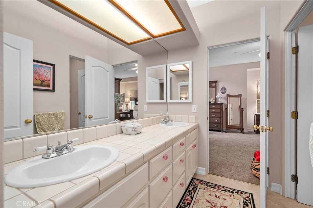 334 Lakeside Avenue Redlands, CA 92373 - Photo 35 of 63 a en suite bathroom with a double vanity sink and a mirror