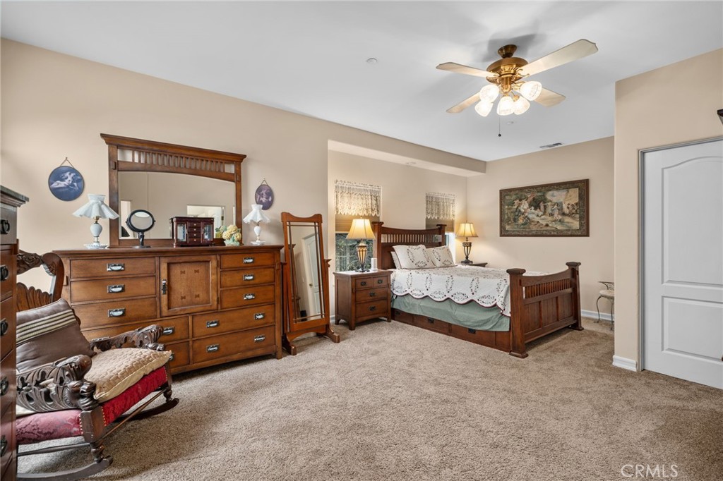 334 Lakeside Avenue Redlands, CA 92373 - Photo 37 of 63 a spacious bedroom with a bed and a dresser