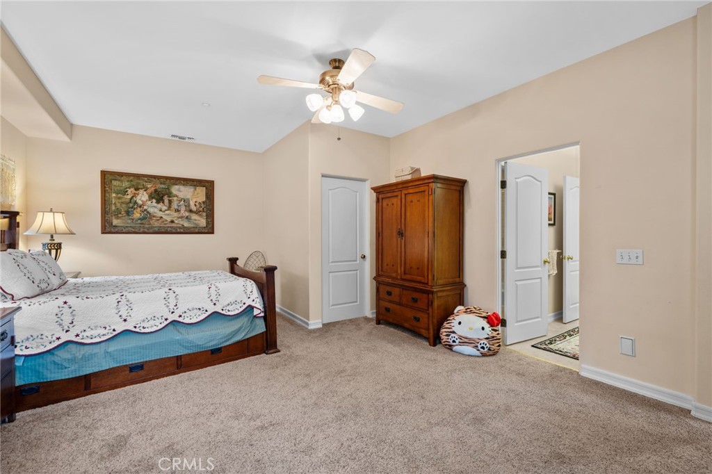 334 Lakeside Avenue Redlands, CA 92373 - Photo 38 of 63 a bedroom with a bed and a chandelier