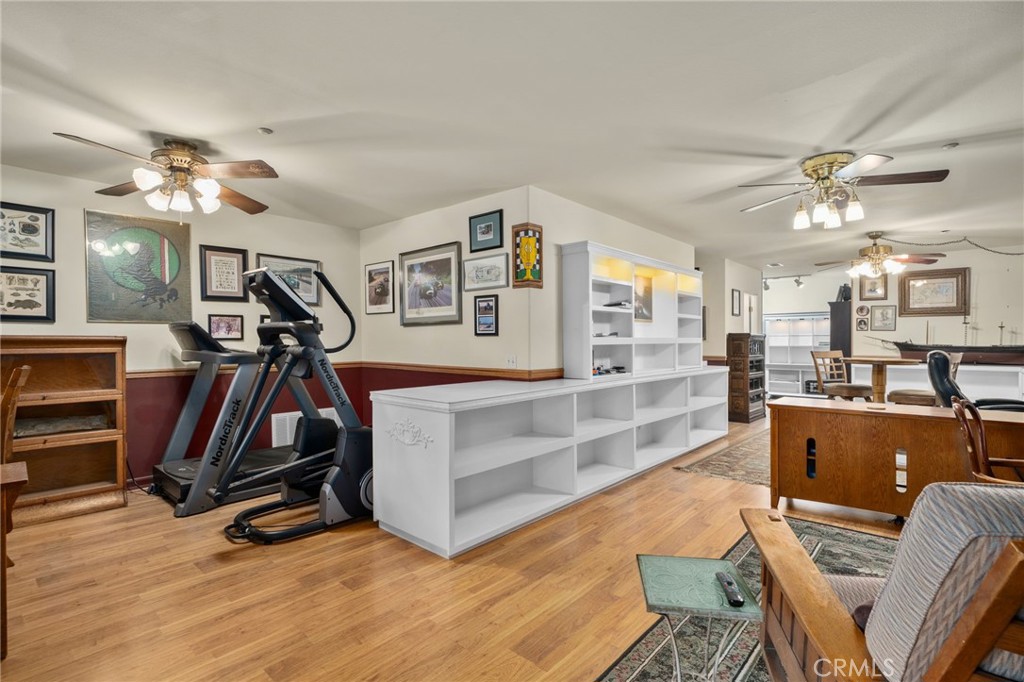 334 Lakeside Avenue Redlands, CA 92373 - Photo 42 of 63 a view of a livingroom with furniture and a gym equipment