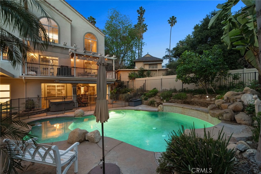 334 Lakeside Avenue Redlands, CA 92373 - Photo 46 of 63 a front view of a house with swimming pool garden and patio