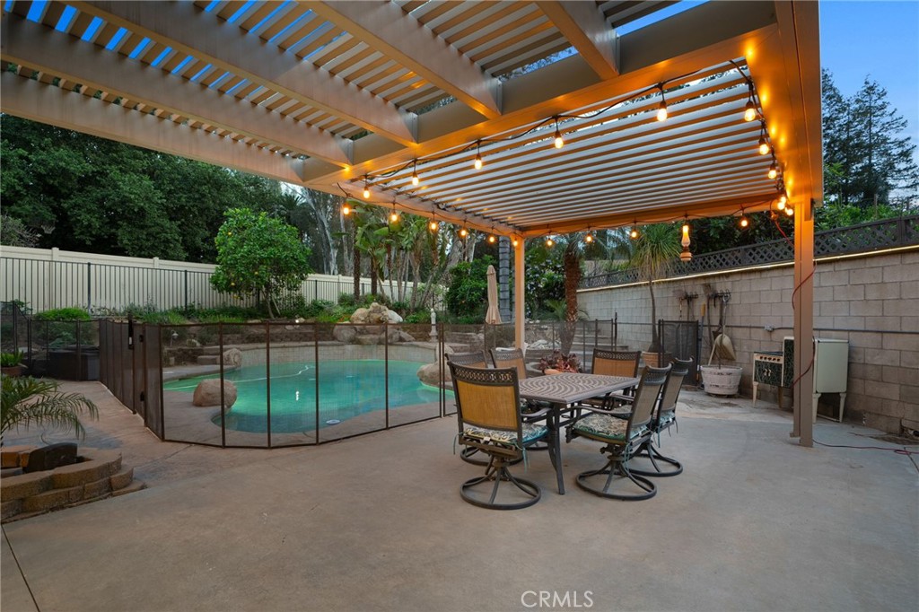 334 Lakeside Avenue Redlands, CA 92373 - Photo 51 of 63 a view of a backyard with a patio and a slide