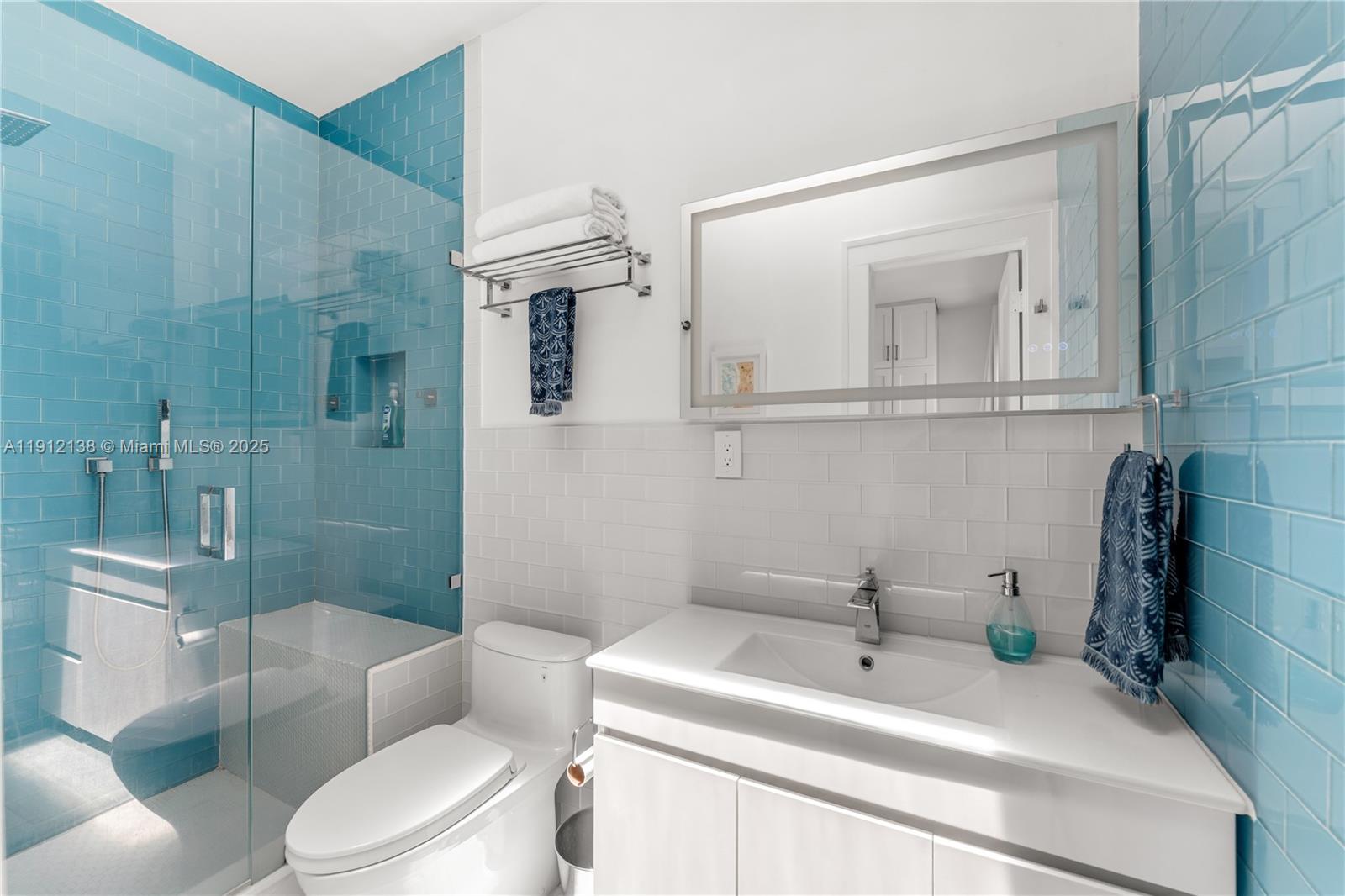 1601 Washington Street Hollywood, FL 33020 - Photo 12 of 41 a bathroom with a sink toilet and shower