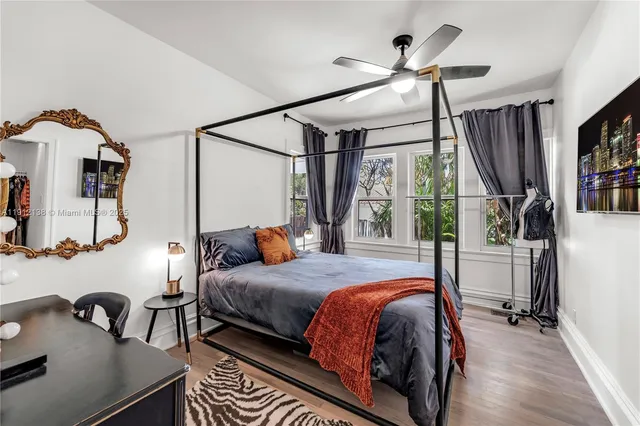 a bedroom with furniture and a window