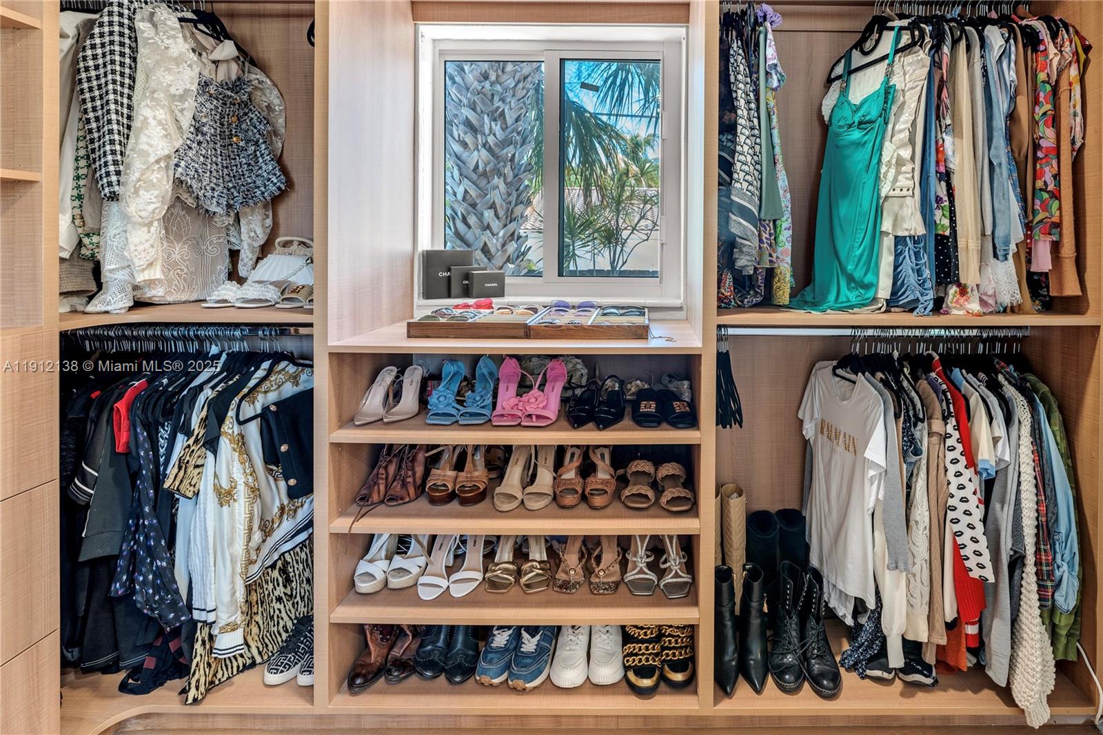 1601 Washington Street Hollywood, FL 33020 - Photo 20 of 41 a view of walk in closet with clothes and shoes