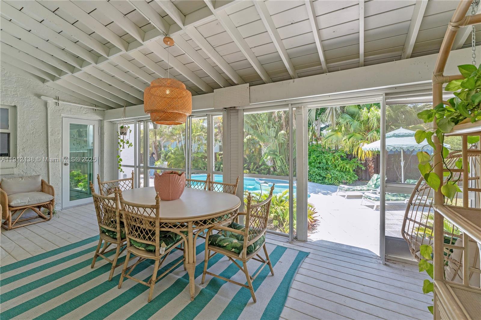 1601 Washington Street Hollywood, FL 33020 - Photo 24 of 41 a outdoor dining space with furniture and wooden floor