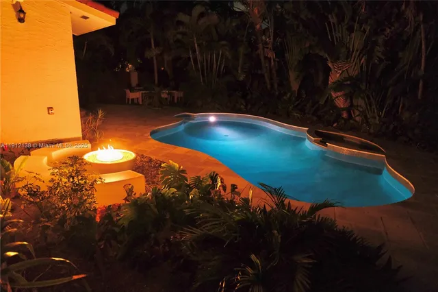 a view of a backyard of the house