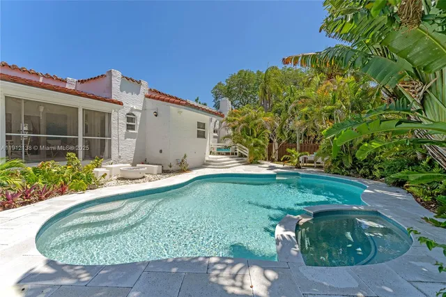 a view of a house with swimming pool