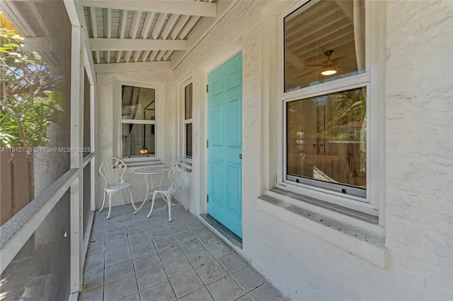 a house with tree in front of it