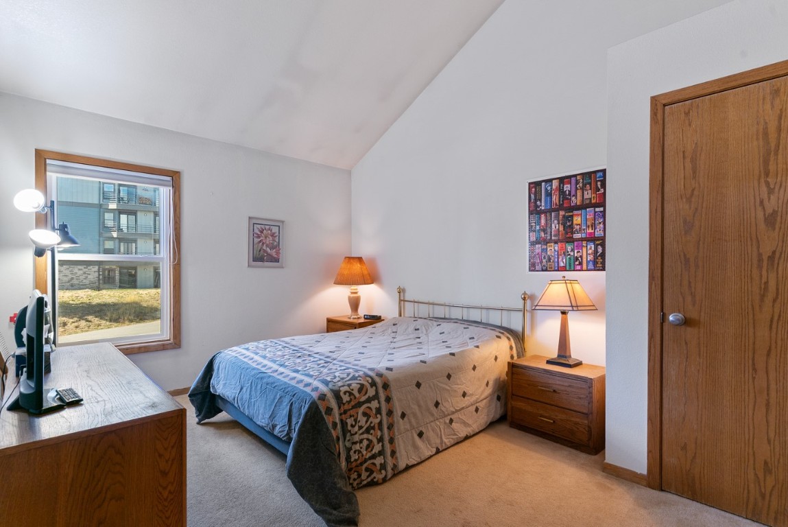 89310 Ryan Gulch Road, Unit 409 Silverthorne, CO 80498 - Photo 10 of 21 a bedroom with a bed and a window