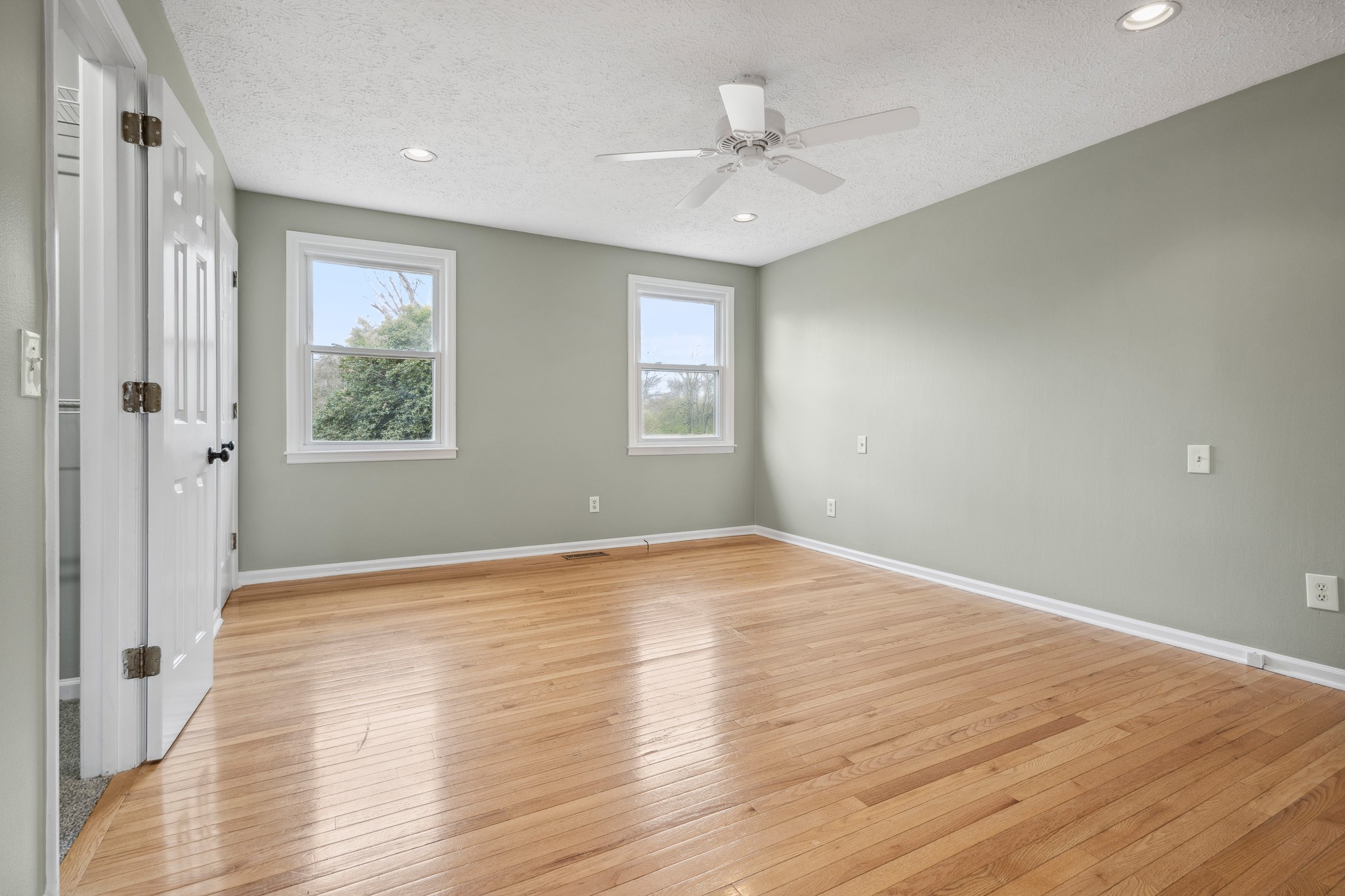 195 Cherokee Road Hendersonville, TN 37075 - Photo 18 of 61 a view of an empty room with wooden floor and a window