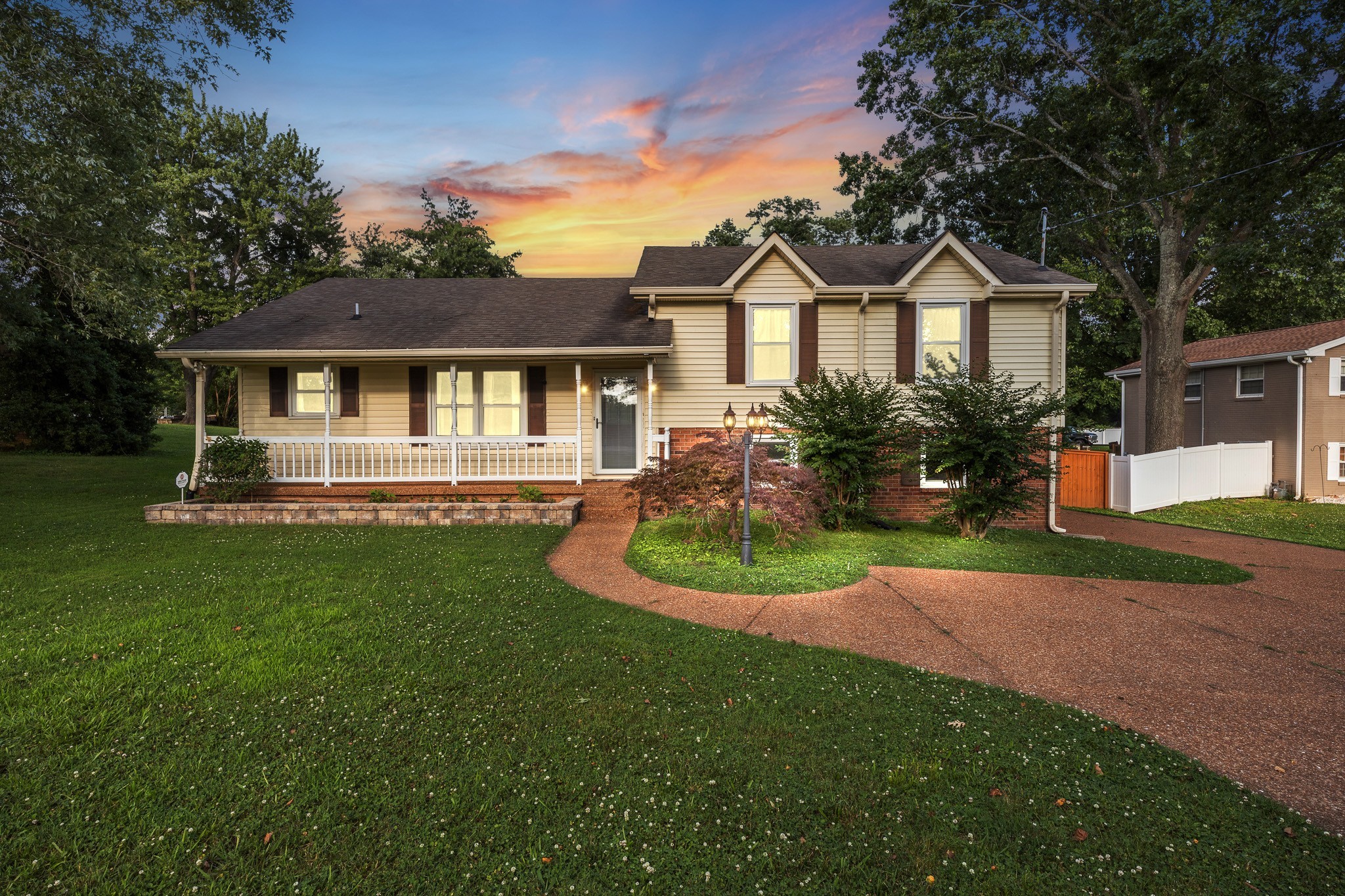 195 Cherokee Road Hendersonville, TN 37075 - Photo 3 of 61 a front view of a house with a yard and trees
