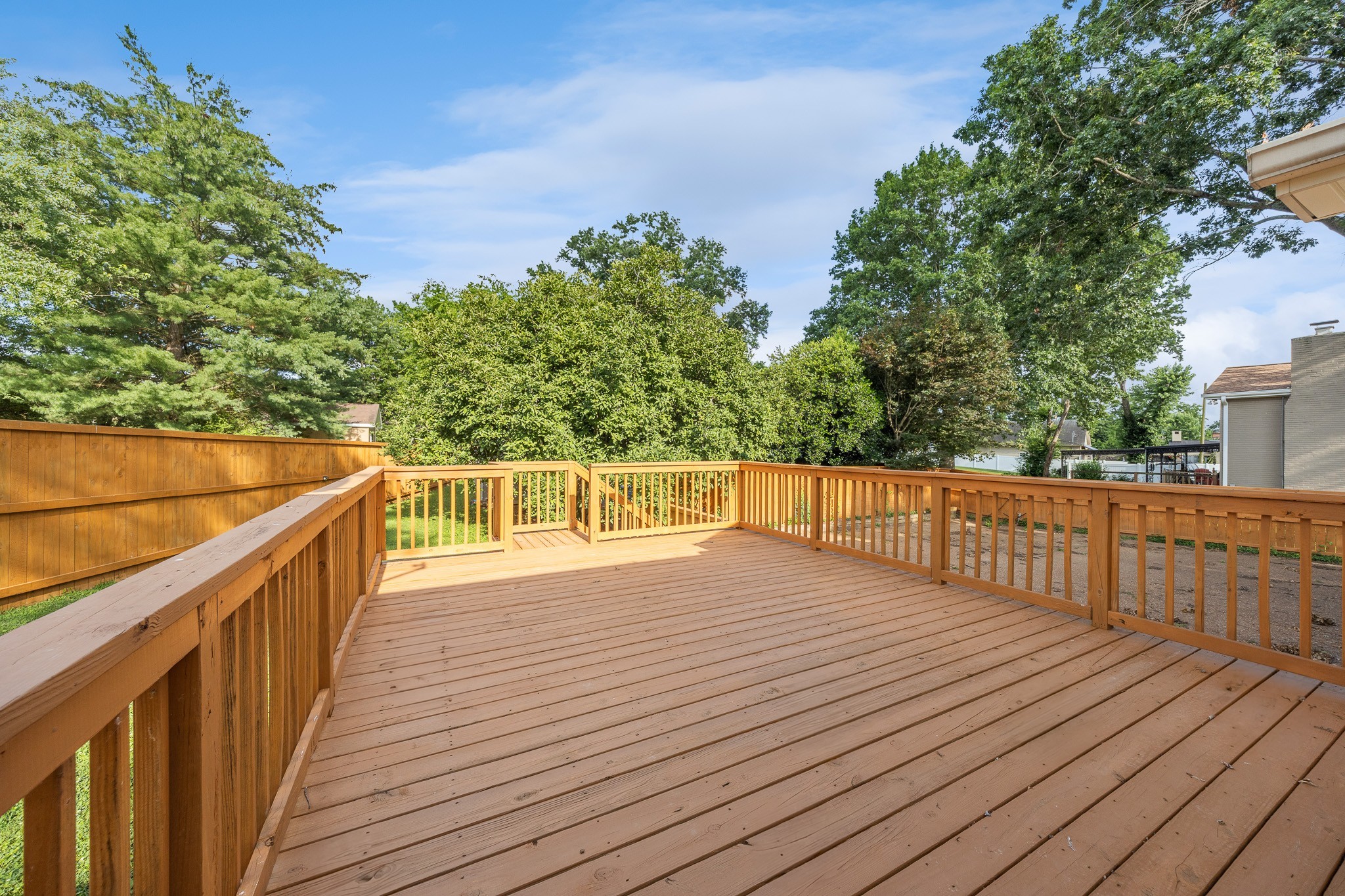 195 Cherokee Road Hendersonville, TN 37075 - Photo 42 of 61 a view of deck with wooden floor and fence next to a yard