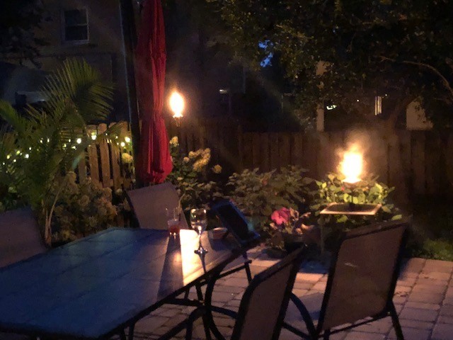 195 Cherokee Road Hendersonville, TN 37075 - Photo 53 of 61 a view of a porch with dining table and chairs with potted plants
