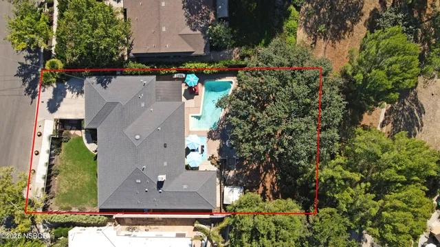 an aerial view of multiple houses with outdoor space