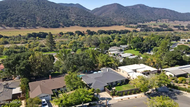 an aerial view of house with mountain view