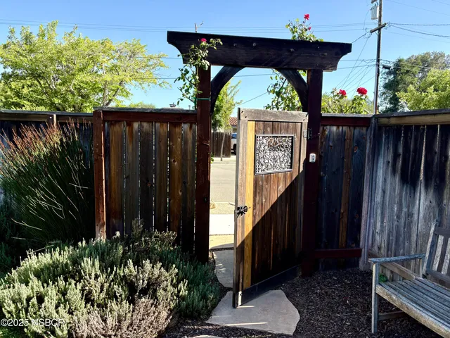 a view of deck with a table and a chairs