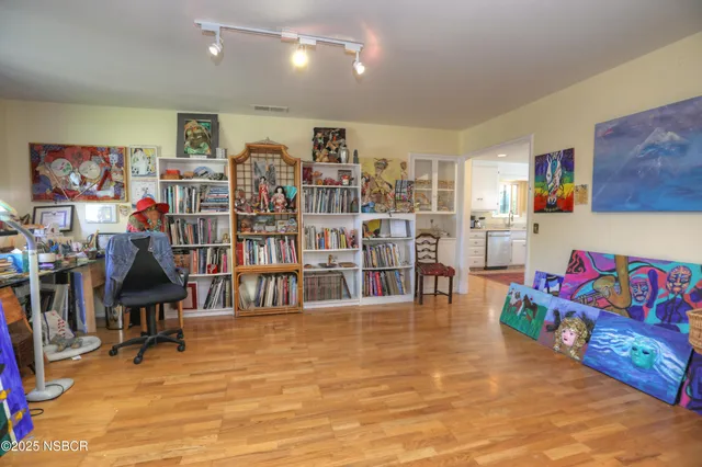 a living room with lots of furniture and a flat screen tv