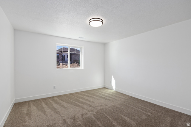 1139 South 4475 West West Point, UT 84015 - Photo 23 of 33 Carpeted empty room with a textured ceiling and baseboards