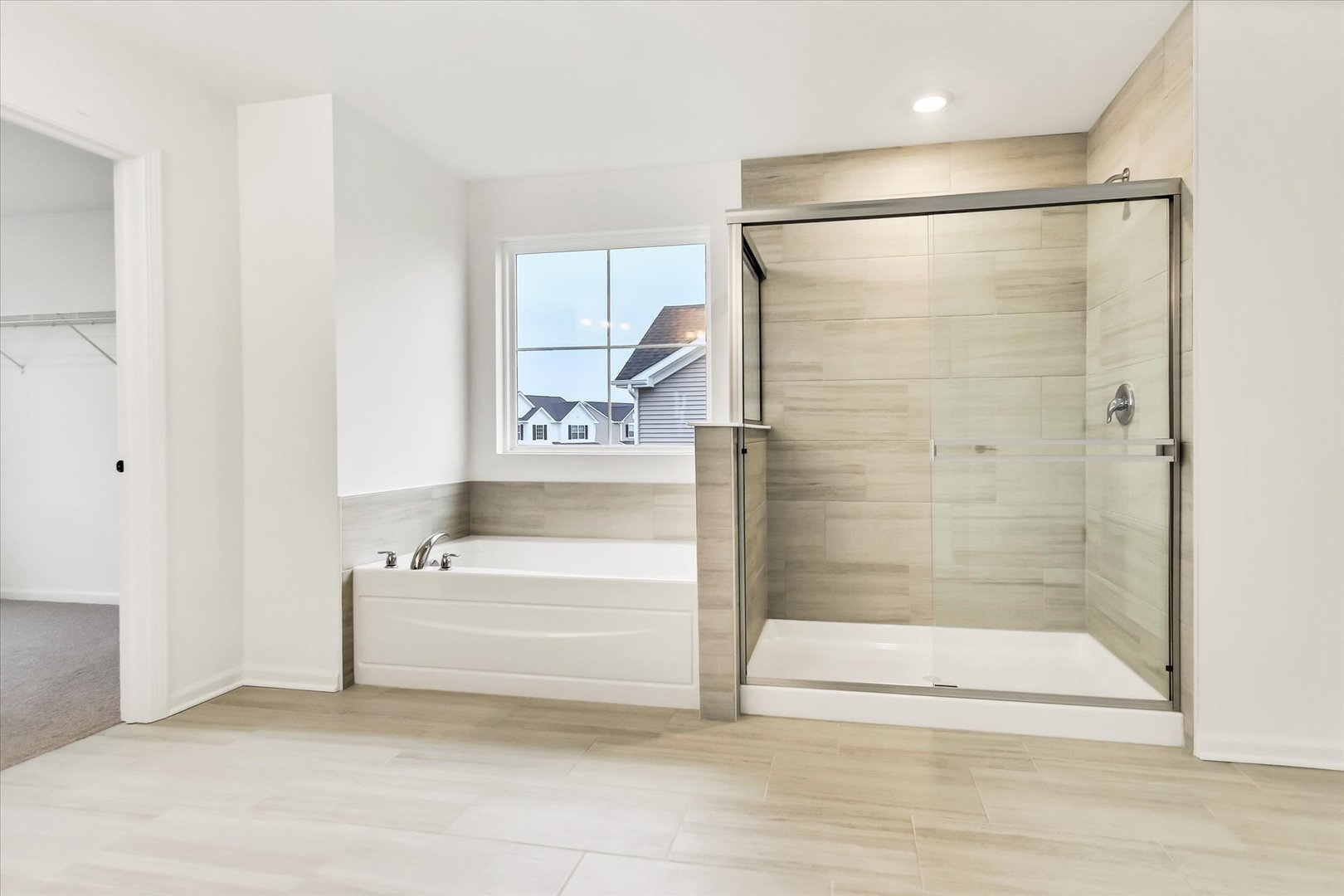 17350 Victoria Lane Lockport, IL 60441 - Photo 21 of 29 a bathroom with a bathtub and a shower
