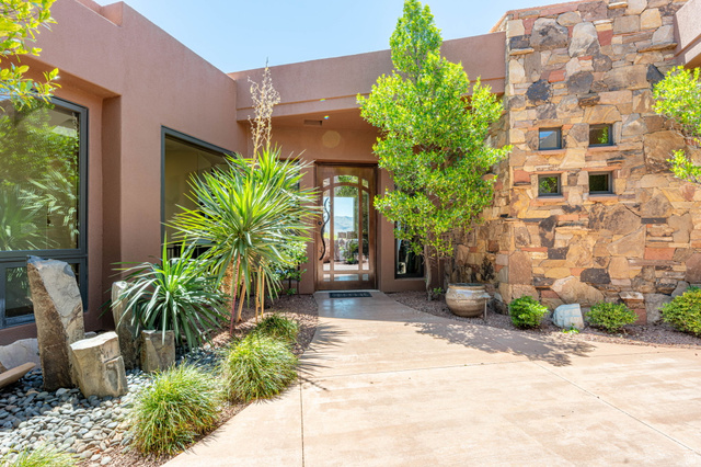 2331 West Entrada Trail, Unit 61 St. George, UT 84770 - Photo 3 of 69 Contemporary exterior with a stucco finish and natural stone accents