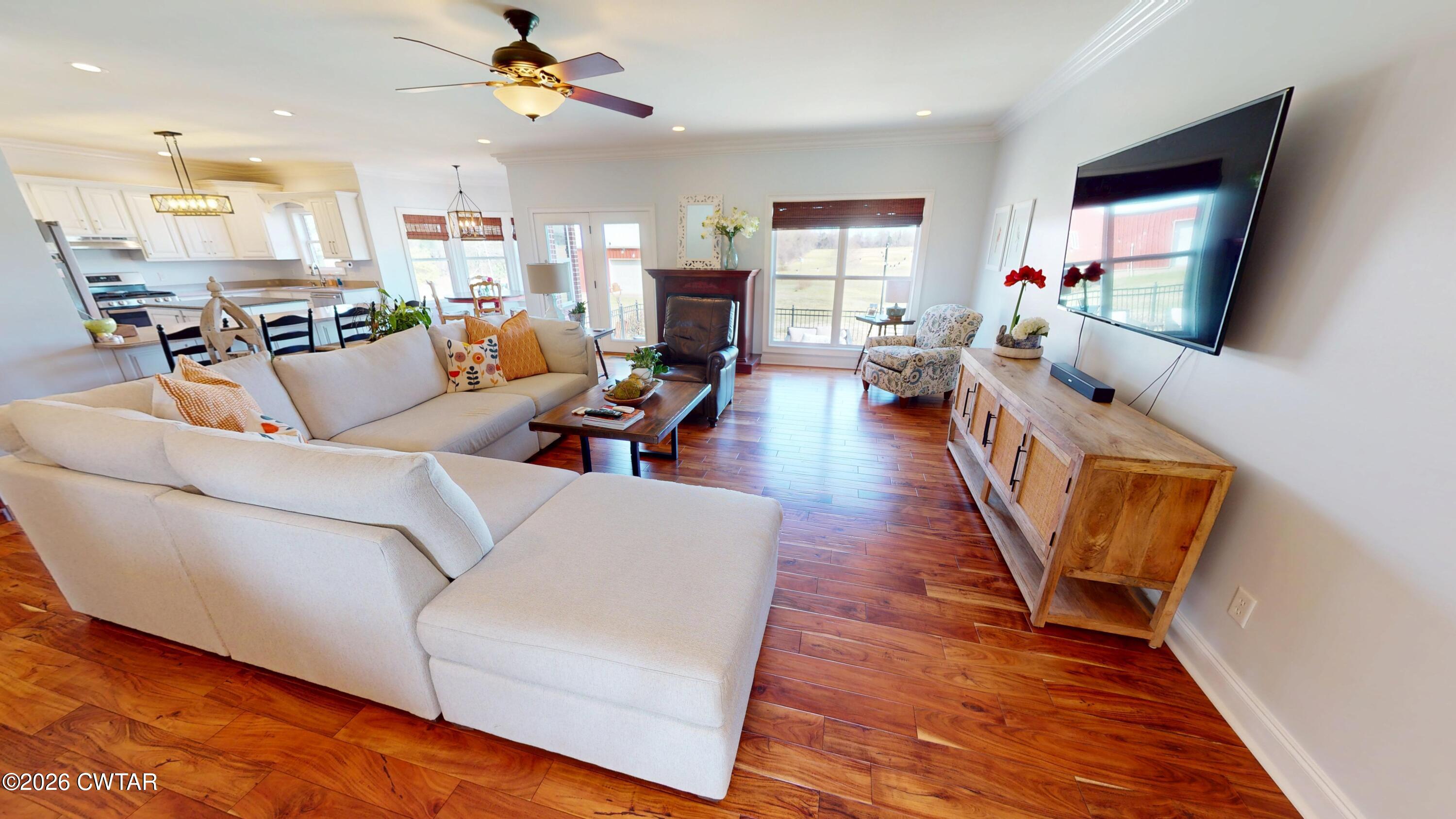 740 Gordon Road Dyersburg, TN 38024 - Photo 13 of 48 a living room with furniture and a flat screen tv