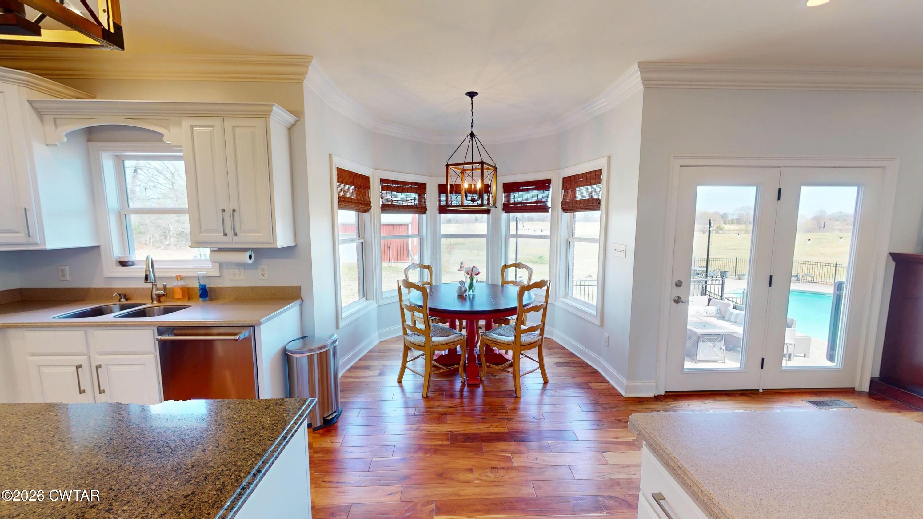 740 Gordon Road Dyersburg, TN 38024 - Photo 20 of 48 a view of a dining room with furniture window and wooden floor