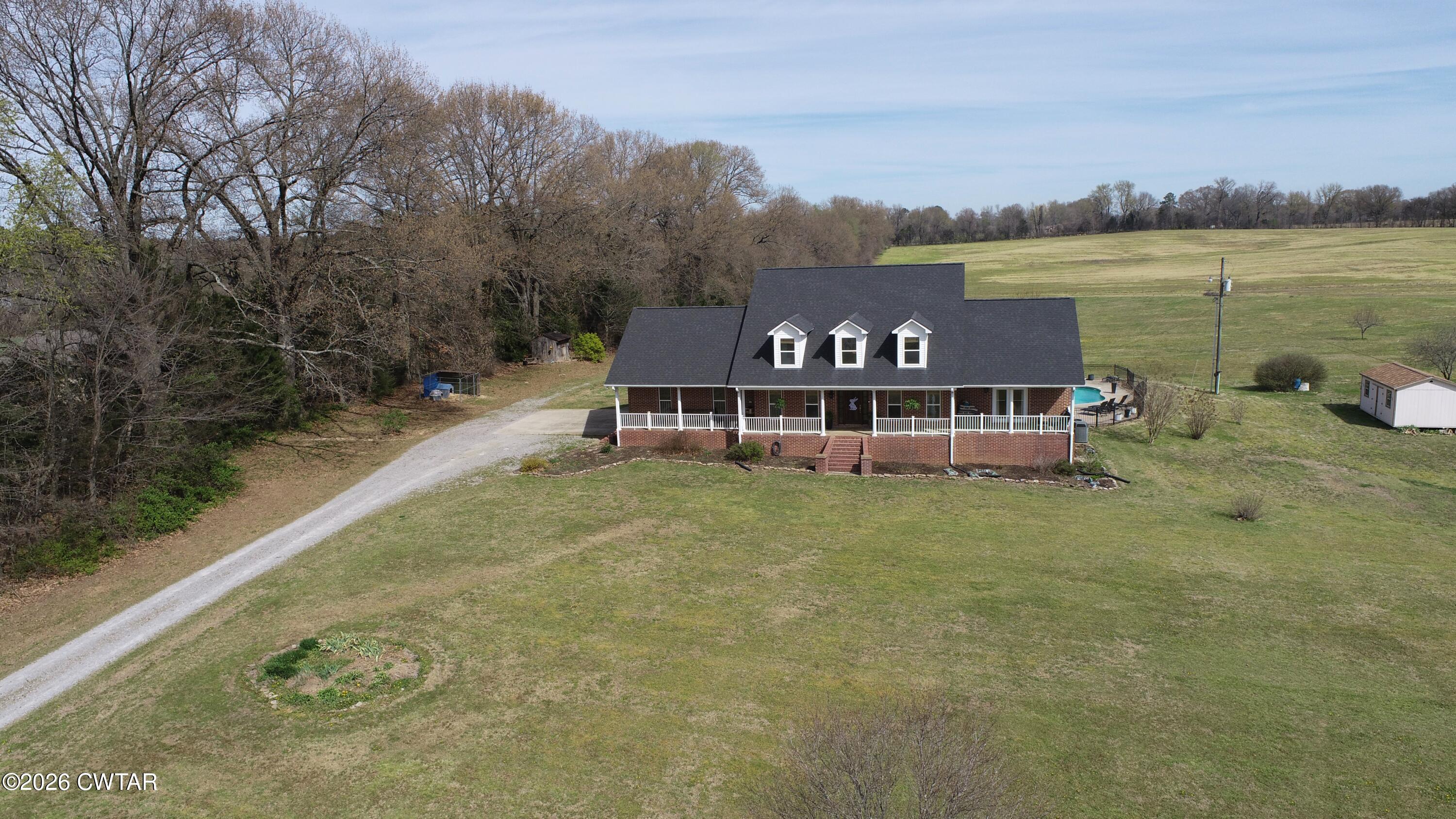 740 Gordon Road Dyersburg, TN 38024 - Photo 2 of 47 a view of a lake with a mountain in the background
