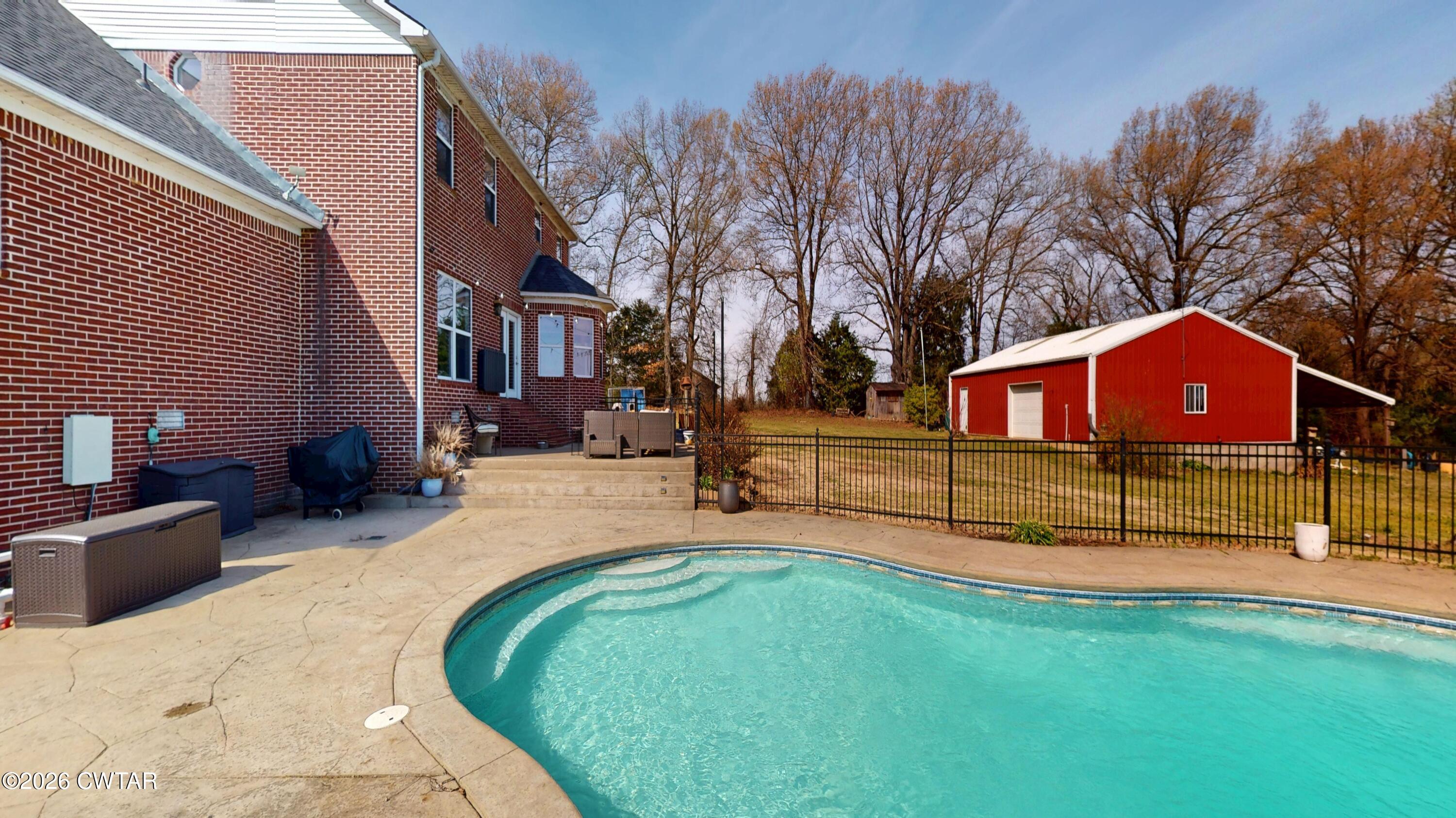 740 Gordon Road Dyersburg, TN 38024 - Photo 40 of 48 a view of backyard with a garden and deck
