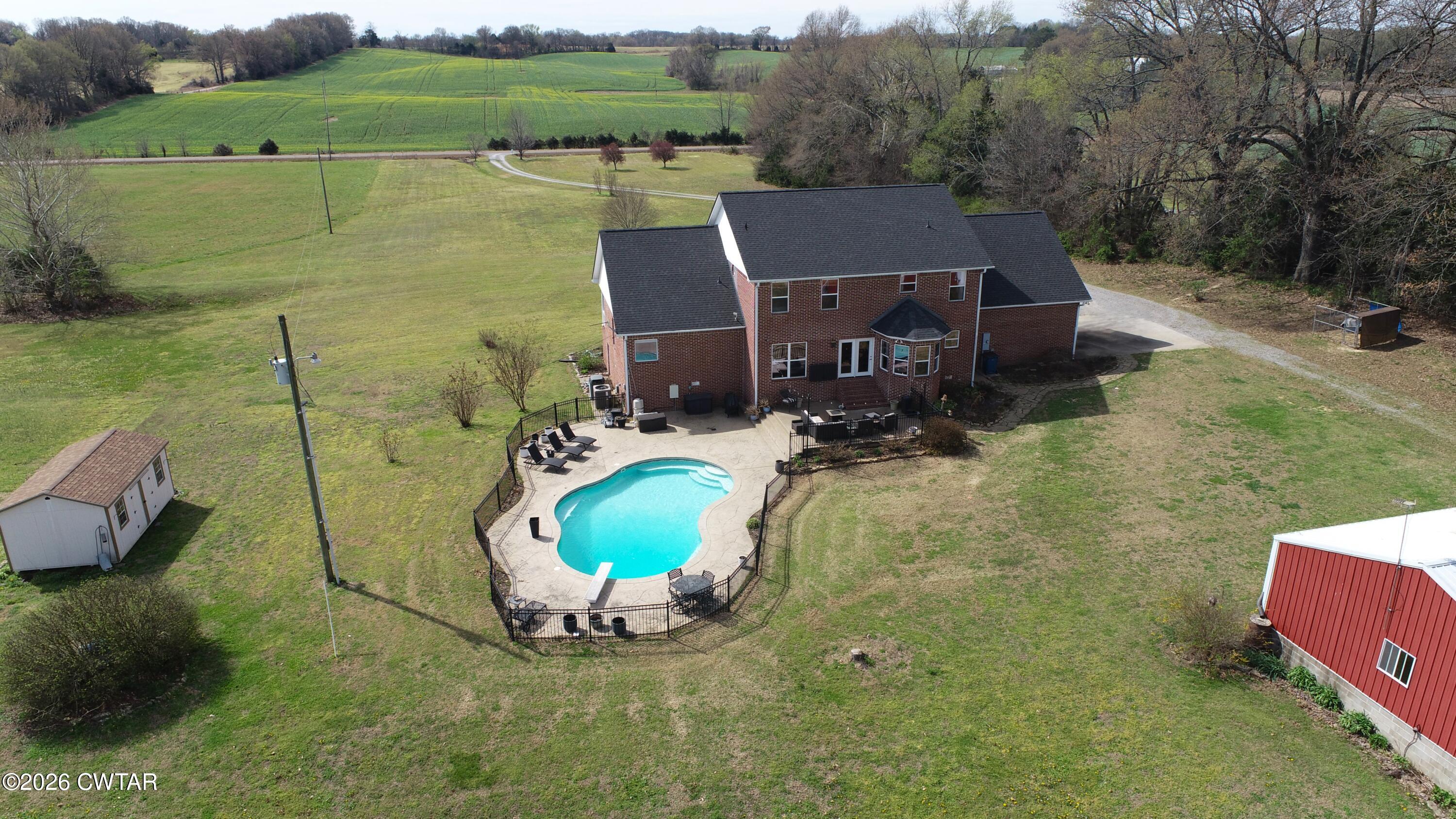 740 Gordon Road Dyersburg, TN 38024 - Photo 6 of 48 an aerial view of a house with a swimming pool