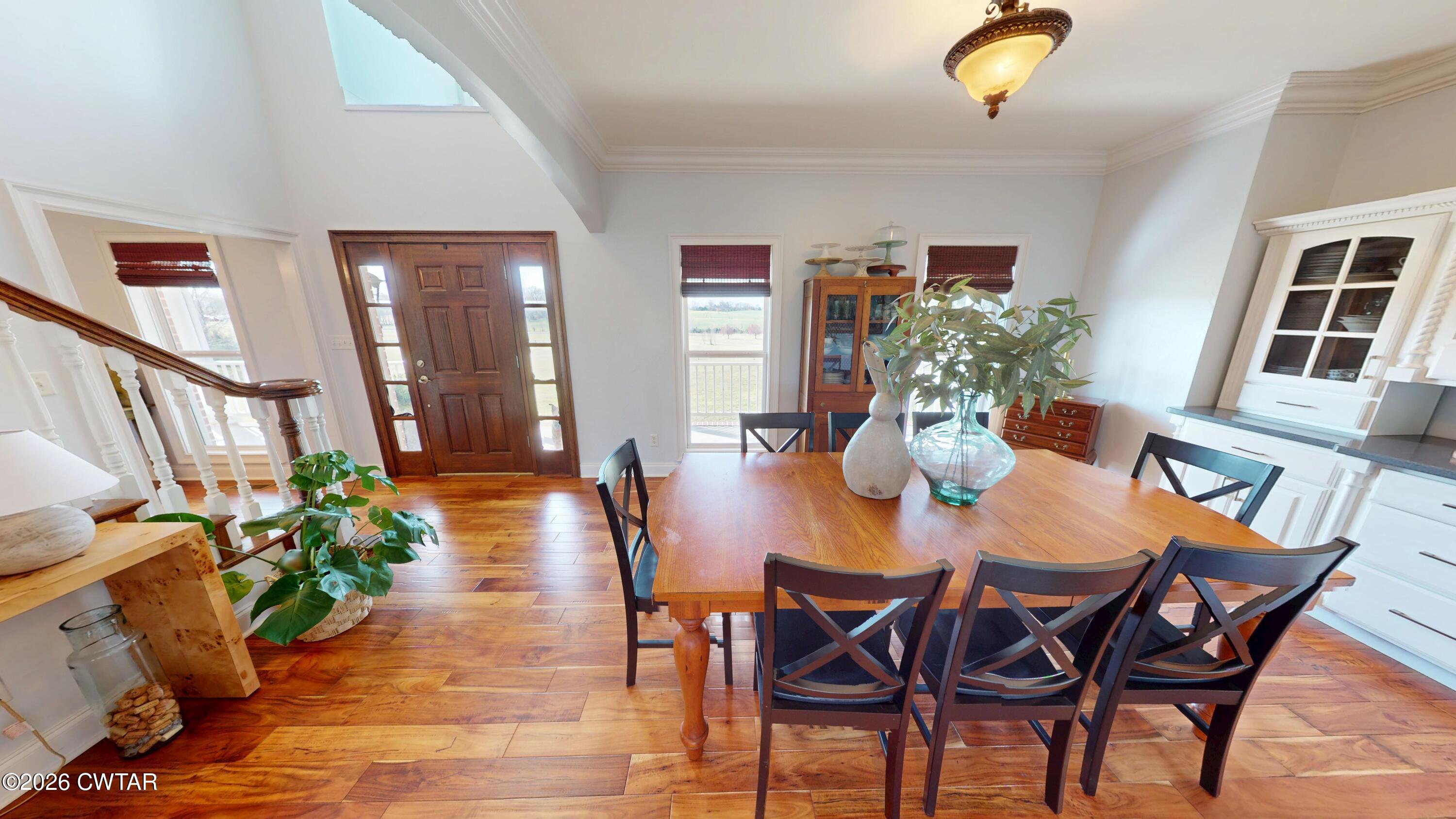 740 Gordon Road Dyersburg, TN 38024 - Photo 7 of 48 a view of a dining room with furniture and wooden floor