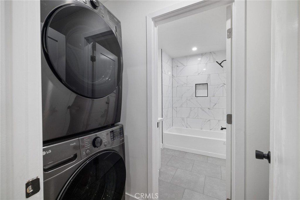 17000 Burbank Boulevard, Unit 101 Encino, CA 91316 - Photo 14 of 24 a bathroom with a sink a mirror and a shower