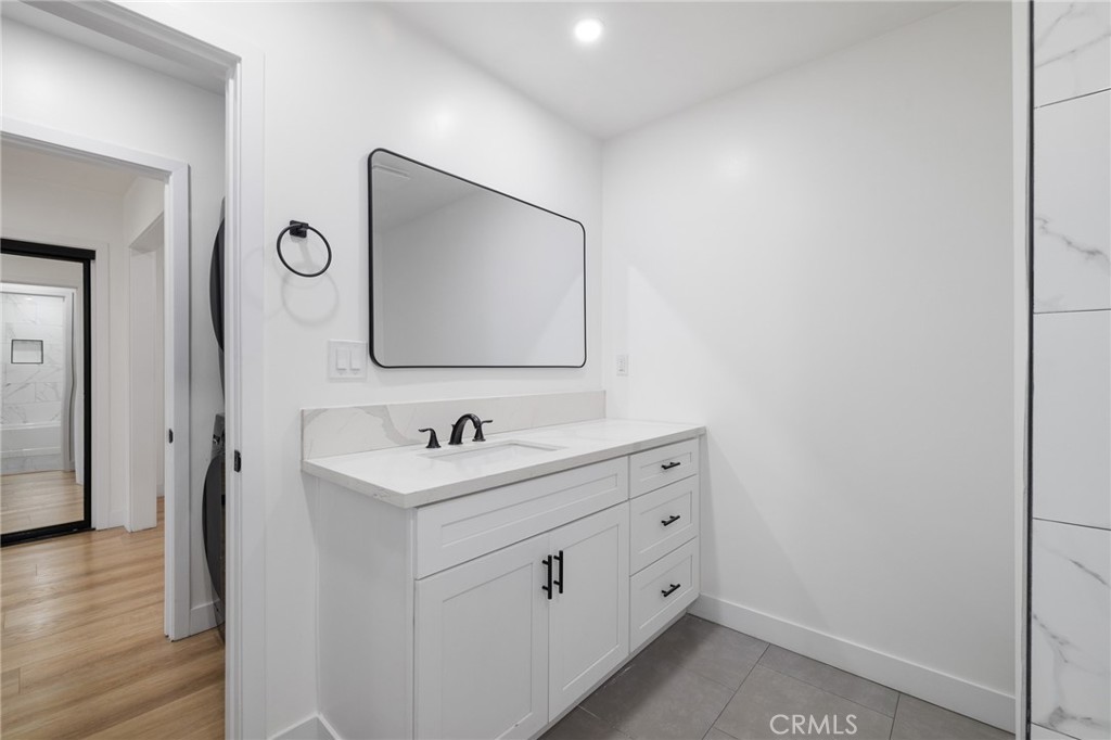 17000 Burbank Boulevard, Unit 101 Encino, CA 91316 - Photo 16 of 24 a bathroom with 2 sink and a mirror