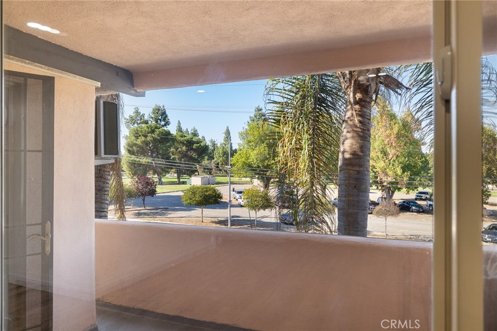 17000 Burbank Boulevard, Unit 101 Encino, CA 91316 - Photo 22 of 24 a view of a balcony with an outdoor space and seating area