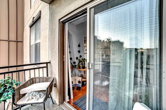 a view of a balcony with furniture