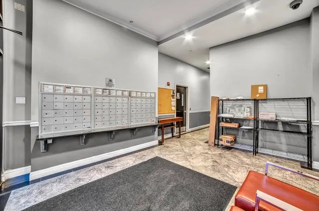 a view of parking garage with cars