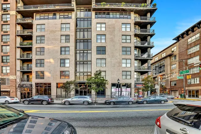 a city street lined with buildings and cars