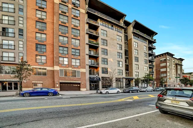 a view of a building with sitting area