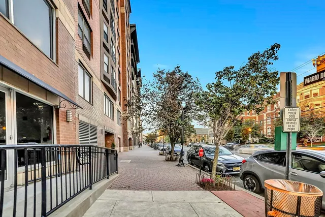 a bathroom with a glass shower door and mirror